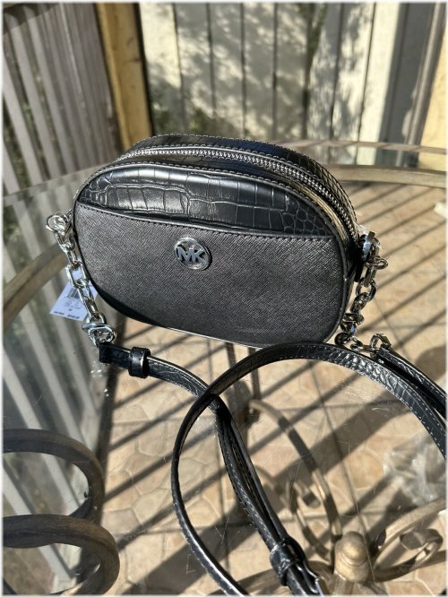 Black Leather Oval Crossbody Bag by Michael Kors